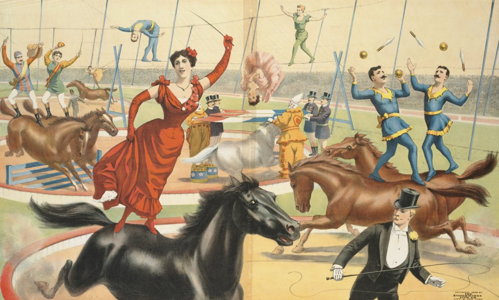 Vintage lithograph circus poster that shows a circus ring. In the front is a woman in a red dress, standing on horseback. Behind her there are more horses, with a variety of circus artists, including acrobats and jugglers, performing on horseback as well. In the background acrobats are walking on a tightrope.